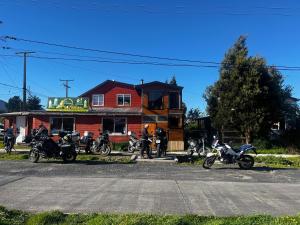a group of motorcycles parked in front of a building at Departamento la espiga in Chaitén +3 photos