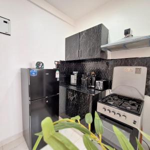 Kuchyň nebo kuchyňský kout v ubytování Jojo' comfy stays