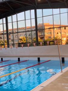 a swimming pool with a view of a building at Studio belle vue in Sète