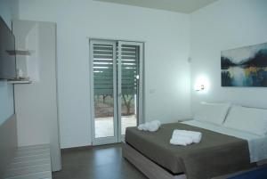 Postel nebo postele na pokoji v ubytování Casa Micò