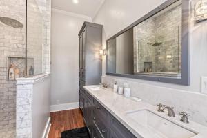 a bathroom with a sink and a mirror at Copper Queen Retreat in Bisbee