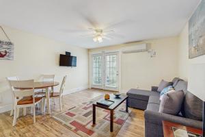 a living room with a couch and a table at The View II at Sheepscot River in Fort Edgecomb