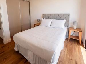 Ένα ή περισσότερα κρεβάτια σε δωμάτιο στο Bright and Stylish 1BR Apt near Shopping del Sol +17 φωτογραφίες