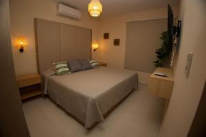 Postel nebo postele na pokoji v ubytování Alojamiento a Unos Pasos de la Playa en Cerritos + 15 fotografií