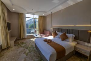 Postel nebo postele na pokoji v ubytování Armada Residence Hotel