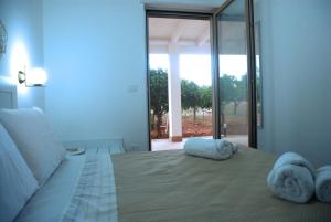 Postel nebo postele na pokoji v ubytování Casa Micò + 18 fotografií