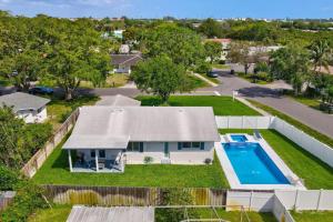 an aerial view of a house with a swimming pool at Delray Oasis Pool Hot Tub in Tropic Isle