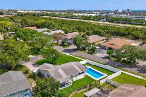 an aerial view of a home with a swimming pool at Delray Oasis Pool Hot Tub in Tropic Isle