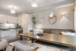 a living room with a table and a couch at TH963- Cozy Ski-in out apartment in Trysil in Trysil