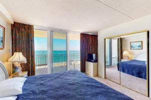 Giường trong phòng chung tại Carousel 1207 +19 ảnh