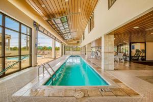 an indoor swimming pool in a house with a large window at Waikiki 406 in Ocean City