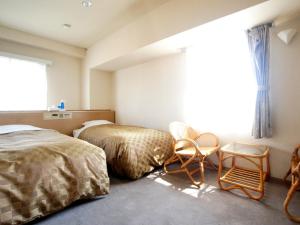 Postel nebo postele na pokoji v ubytování Hotel Trend Nagano + 15 fotografií