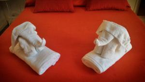 Posteľ alebo postele v izbe v ubytovaní B&B Perla
