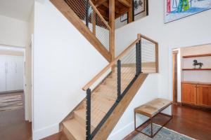 a staircase in a house with a chair at Blue Moon Challet in Big Sky Mountain Village
