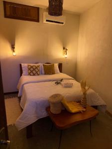 Ένα ή περισσότερα κρεβάτια σε δωμάτιο στο Chalé Caju