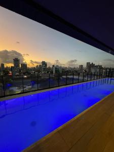 a swimming pool with a view of the city at Tolive One - Ilha do Leite, Recife in Recife +21 photos