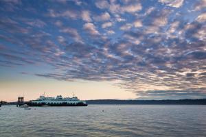 a large boat in the water under a cloudy sky at Olympic View Cottage in Gregory Heights +1 photo