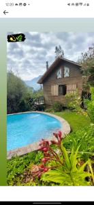 a picture of a house and a swimming pool at Luna del maipo in El Ingenio +20 photos