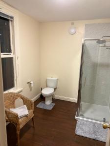 a bathroom with a toilet and a shower at Collin street in Nottingham