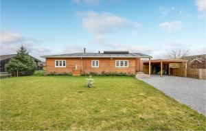 a house with a large yard in front of it at Stunning Home In Sydals With Sauna in Skovbyballe +15 photos