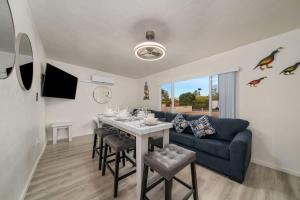 a living room with a table and a couch at 3BR 2BA Comfy Home with Jacuzzi in Tucson