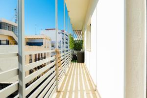 a balcony of a building with a fence at Iconic 2 Bedroom Apartment in Tangier