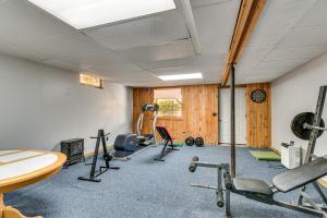a gym with several exercise equipment in a room at Private Yard Secluded Hannibal Cabin in the Pines in Fulton
