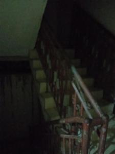 a set of stairs in a dark room at Warf in Brazzaville
