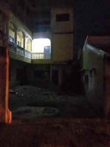 a view of a building with a light at night at Warf in Brazzaville