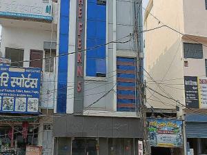 a building with signs on the side of a street at Hotel O The Ferns in Thānesar +25 photos