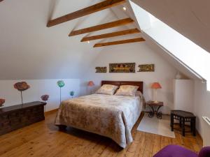 a bedroom with a bed in a attic at Chambres d'Hôte Air Marin in Lannion
