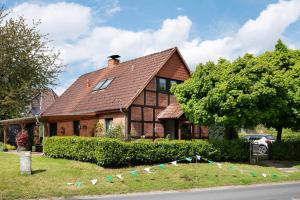 a house with a fence in front of it at Ferienhaus Thomas in Colnrade