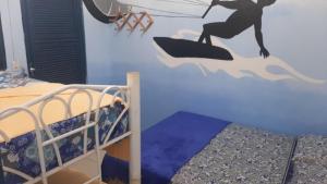 Ένα ή περισσότερα κρεβάτια σε δωμάτιο στο Hostel Green house beach