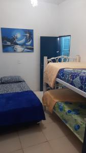 Ένα ή περισσότερα κρεβάτια σε δωμάτιο στο Hostel Green house beach