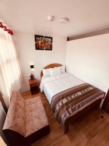 Ένα ή περισσότερα κρεβάτια σε δωμάτιο στο Pakari wasi inn