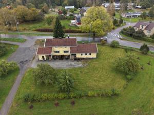 an aerial view of a house on a green field at Korpinpesä in Korppoo