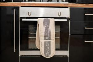 a towel is hanging from an oven door at RB home Stockport in Stockport