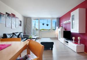 a living room with a couch and a table at Ferienwohnung Manuela in Sankt Englmar