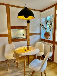 a dining room with a table and chairs at Wohnung In Wolfenbüttel in Wolfenbüttel