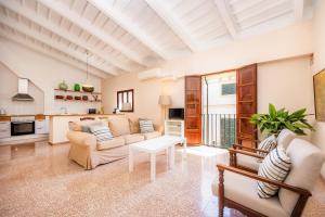 a living room with a couch and a table at Can Claret in Felanitx