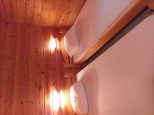 a room with a ceiling with lights on the wall at Chalet, Confort, Loisirs et Piscine in Mauroux