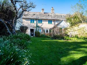 an old house with a yard in front of it at 2 Bed in Studland DC069 in Studland