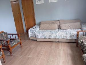 Ένα ή περισσότερα κρεβάτια σε δωμάτιο στο chacara paz no vale