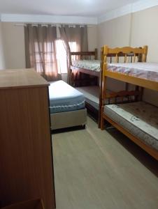 Ένα ή περισσότερα κρεβάτια σε δωμάτιο στο chacara paz no vale