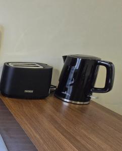 Příslušenství pro přípravu čaje a kávy v ubytování Micha Loft