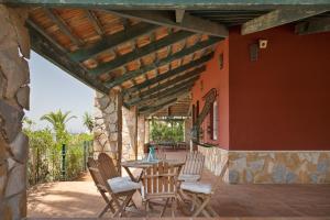 a patio with a table and chairs on a patio at Vivero El Suso in La Manga del Mar Menor