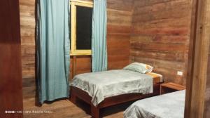 Ένα ή περισσότερα κρεβάτια σε δωμάτιο στο Wasi ñusta Yaku +22 φωτογραφίες