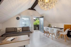a living room with a couch and a table at Ferreira's Loft - Ferienwohnung in St. Blasien