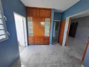 a room with a wooden cabinet and a hallway at Nos Soño in Upper Prince's Quarter +8 photos