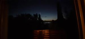 a view of the night sky from a window at Vista Alago in Villa Ciudad Parque +40 photos